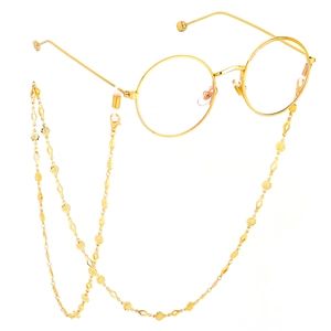 Handmade gold chain for glasses featuring floral and diamond-shaped metal charms