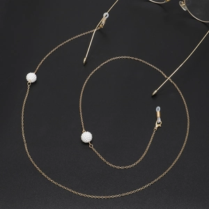 Golden metal eyewear chain with white pearl beads and anti-slip silicone loops