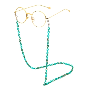 Detail of teal acrylic resin chain link strap attached to gold-rimmed round eyewear
