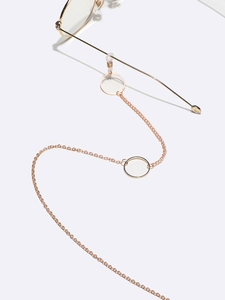 Rose gold anti-slip eyewear chain with geometric circle accents on a white background
