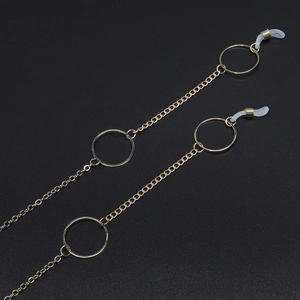 Golden metal glasses chain with geometric circles and white anti-slip silicone loops
