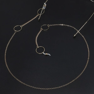 Chic golden metal eyewear chain with geometric circle accents and non-slip rubber loops