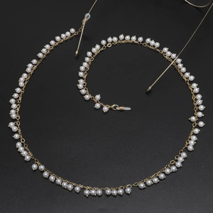 Golden eyewear chain featuring 6mm white pearls with adjustable rubber loops and lobster clasps