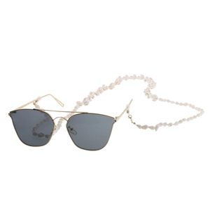 Golden sunglasses with white small seashell eyeglass chain strap on white background