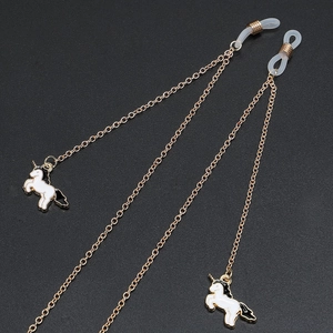 Golden anti-slip eyewear chain featuring black and white enamel unicorn pendants