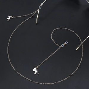 Golden eyewear chain with white unicorn pendants and anti-slip silicone loops