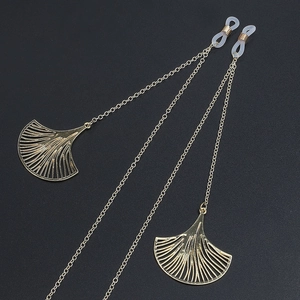 Golden metal eyewear chain with decorative gingko leaf pendants and anti-slip loops