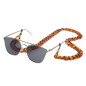 Retro leopard resin eyewear chain with gold frame pilot sunglasses on white background