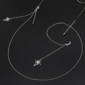 Silver metal eyewear chain featuring sparkling star pendants and non-slip silicone loops