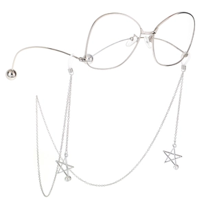 Silver metal eyewear chain with star charms and pearls on retro large frame glasses