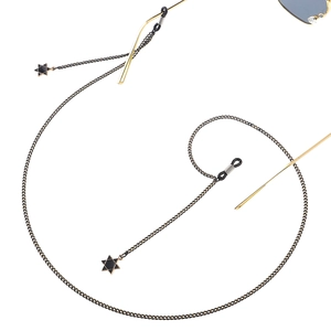 Fashionable gold eyewear chain with black hexagram pendants and adjustable rubber loops