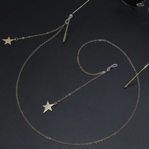 Golden star pendant eyewear chain with fine metal links and non-slip silicone loops