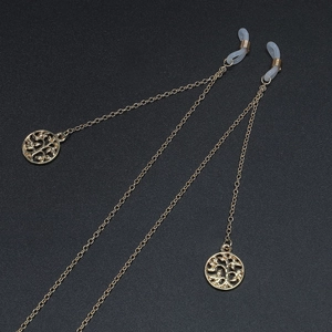 Chaîne à lunettes dorée avec pendentifs arbre de vie et boucles en silicone blanc