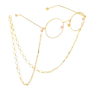 Golden round frame glasses with geometric diamond and circle link chain accessory