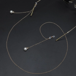 Elegant gold metal eyewear chain with white pearls and anti-slip silicone loops