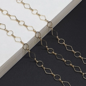 Chic gold chain necklace featuring alternating circular and rhombic geometric metal links
