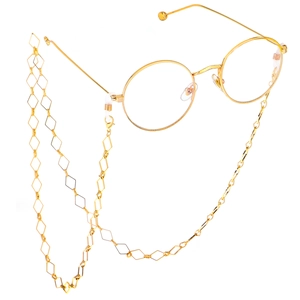 Golden round frame glasses with a geometric rhombus chain on white background