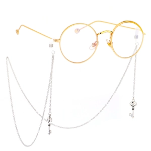 Gold metal round glasses with silver anti-slip chain featuring a skull key pendant