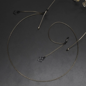 Fashionable black metal eyewear chain with anchor pendants and non-slip rubber ends