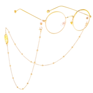 Gold round glasses with metal chain featuring a 'Believe' engraved charm on white background