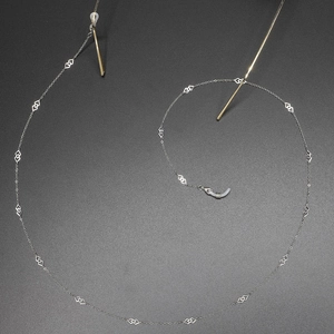 Silver stainless steel eyeglass chain with hollow diamond geometric links and silicone grips