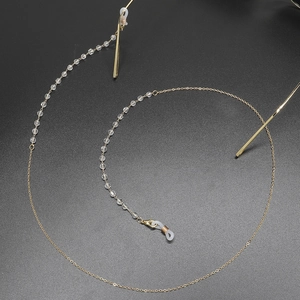 Golden eyewear chain with transparent crystal beads and non-slip silicone loops for glasses