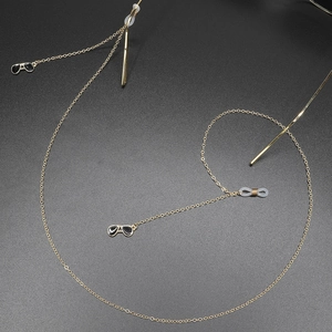 Golden anti-slip eyewear chain with aviator sunglasses pendants on dark grey background