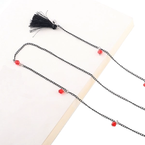 Chaîne à lunettes en métal noir avec perles de cristal rouges et pompons noirs