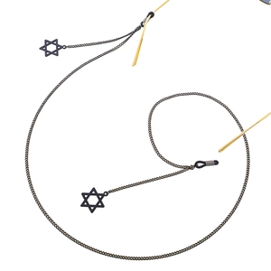 Fashionable black metal eyewear chain with hollow hexagram star pendants on white background