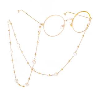 Golden round glasses with elegant pearl chain necklace and sleek metallic frame