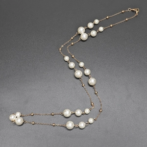 Elegant gold metal long sweater chain with multi-size white pearls and adjustable clasp