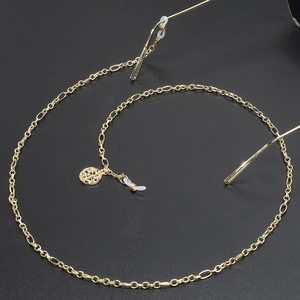 Golden Tree of Life eyewear chain with delicate metal links and silicone loop connectors