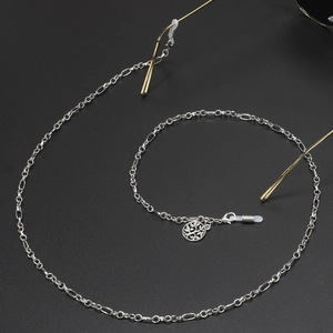 Silver Tree of Life eyewear chain with Figaro link design attached to glasses frames