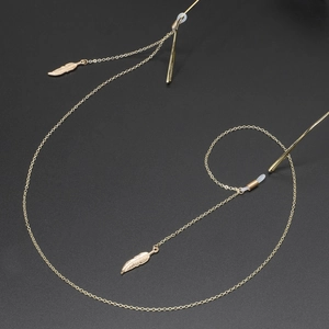 Golden metal eyewear chain with feather pendants and non-slip silicone loops