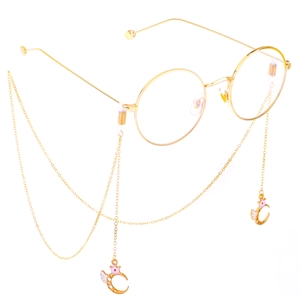 Golden round glasses with decorative eyeglass chain featuring moon and crown charms
