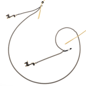Fashionable black eyewear chain featuring elegant giraffe pendants and golden accents
