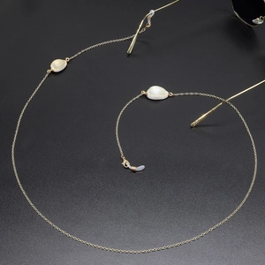 Minimalist gold chain eyewear strap with white shell charms and non-slip silicone loops