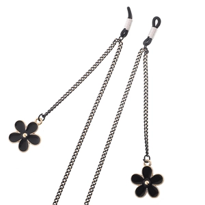 Chaîne de lunettes dorée tendance avec pendentifs fleurs noires et attaches antidérapantes