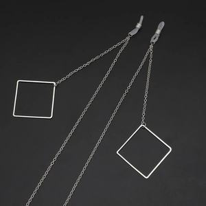 Silver metal eyewear chain featuring geometric square pendants and anti-slip silicone loops