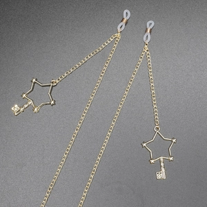 Non-slip gold glasses chain featuring star and key pendants with silicone loop ends