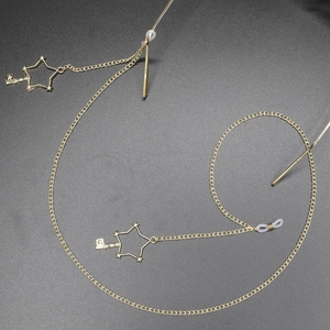 Golden eyewear chain featuring star and key charms with non-slip silicone loops