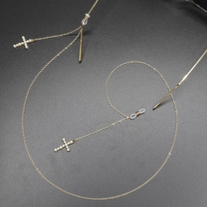 Golden anti-slip eyewear chain featuring pearl cross pendants and silicone loops
