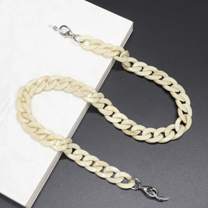 Detail of cream marble acrylic glasses chain with flat link design and lobster clasps