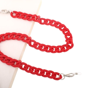 Detail of red acrylic glasses chain with lobster clasps and non-slip rubber loops