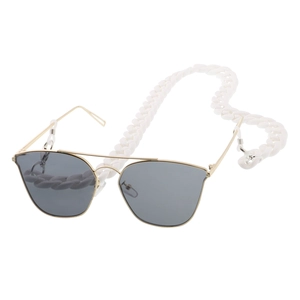 Detail of chunky white acrylic chain link strap on gold aviator sunglasses with grey lenses