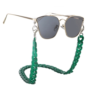 Detail of dark green acrylic link chain with gold metal clips for eyewear attachment