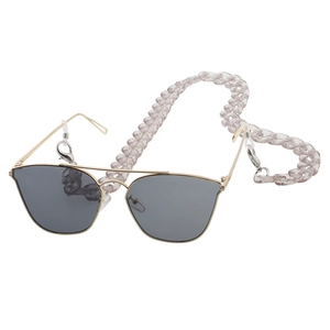 Detail of light purple acrylic chain strap with rubber loops on gold sunglasses