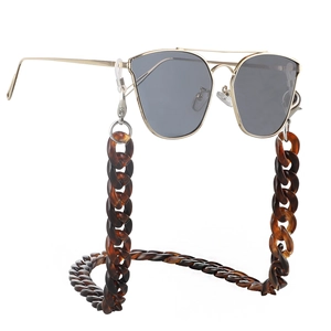 Detail of dark amber tortoiseshell acrylic chunky chain strap for sunglasses