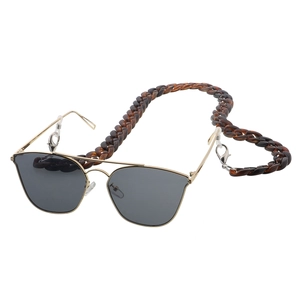 Close-up of amber tortoiseshell acrylic eyewear chain with metal frame sunglasses