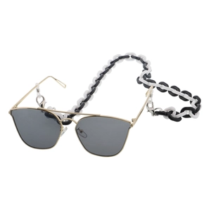 Detail of chunky black and white acrylic eyewear chain with golden metal frame glasses